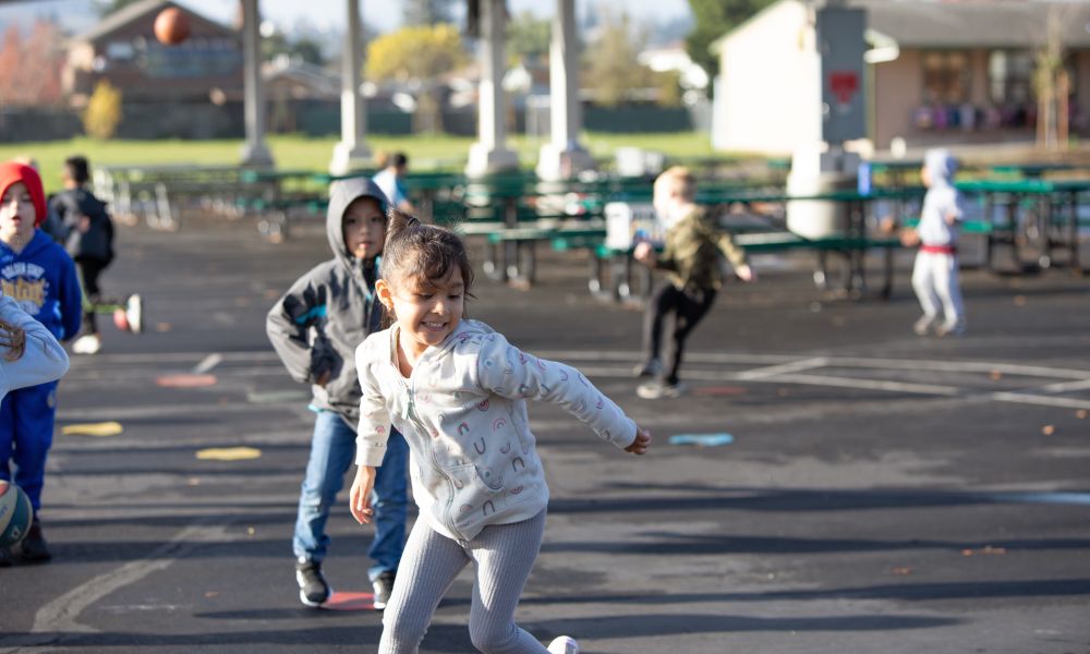 McKinley students running around on the blacktop outside