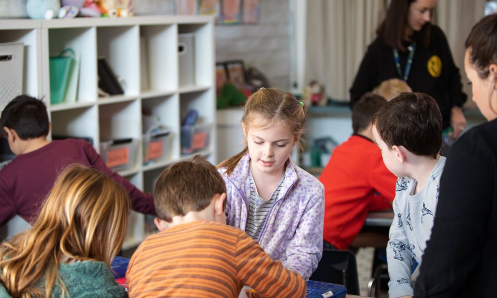 A group of Penngrove students working together at a desk.