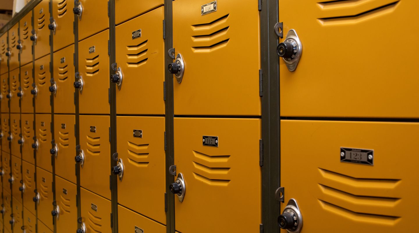 A close-up side view of yellow lockers