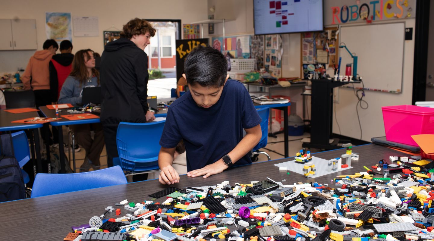 KJHS building with legos in their robotics class