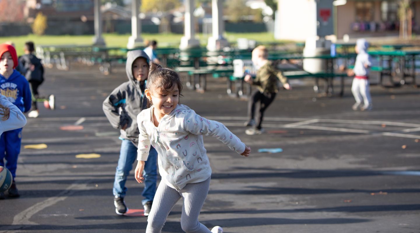 McKinley students running around on the blacktop outside