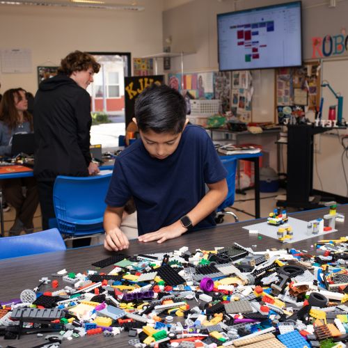 KJHS building with legos in their robotics class