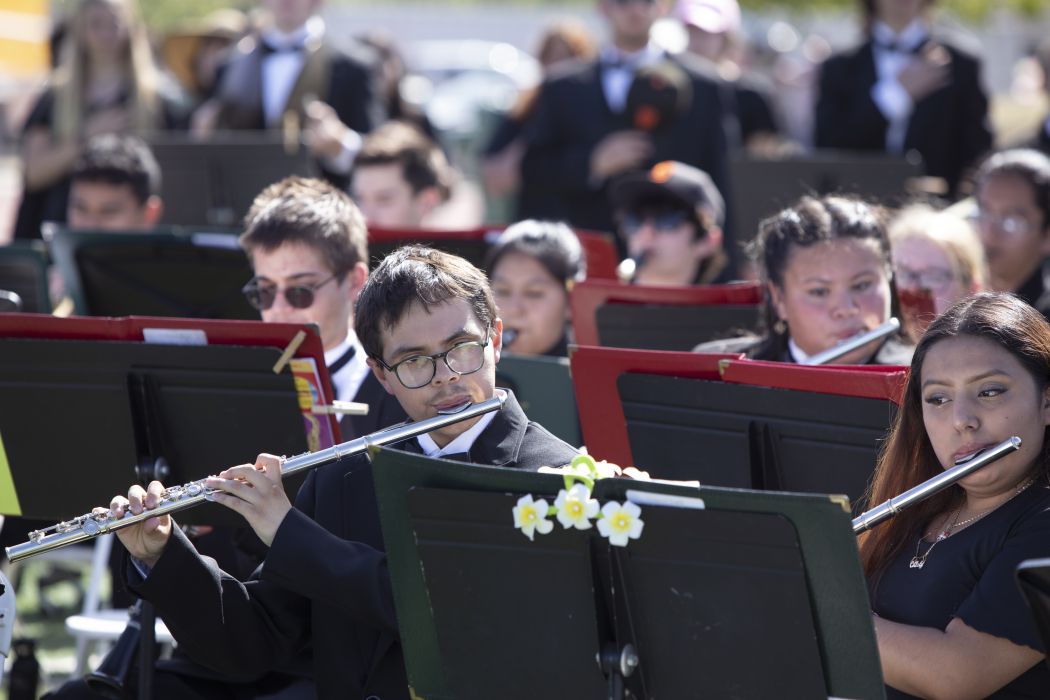 Student in the CGHS band, playing their flutes at the graduation ceremony.